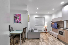 South Beach SoFi apartment with direct Beach, chairs, and umbrella access